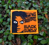 Rectangular orange and black embroidered patch for the classic horror movie black sunday.