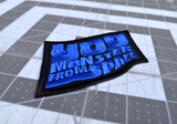 Close up detail of a blue and black embroidered logo patch for the classic kaiju monster movie, Yog, Monster from Space.