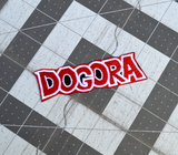 A red, black, and white embroidered logo patch for Dogora, the classic Kaiju monster movie.