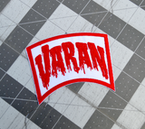 Red and white embroidered logo patch for the classic Kaiju giant monster movie, Varan, the Unbelievable.