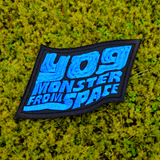 Blue and black embroidered logo patch for the classic kaiju monster movie, Yog, Monster from Space.