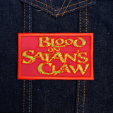 Rectangular red patch with textured yellow text 'Blood on Satan's Claw', inspired by the classic folk horror movie.