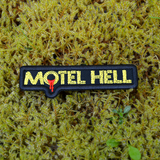 Rectangular black and yellow embroidered logo patch for the classic comedy horror slasher movie Motel Hell.