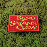 Rectangular red patch with textured yellow text 'Blood on Satan's Claw', inspired by the classic folk horror movie.