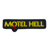 Rectangular black and yellow embroidered logo patch for the classic comedy horror slasher movie Motel Hell.