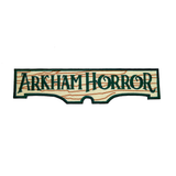Rectangular embroidered patch resembling a wooden sign with the logo of the Arkham Horror board and card games.