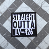 Square black and white embroidered patch that says straight outta LV-426.