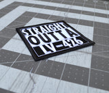 Close up detail of a square black and white embroidered patch that says straight outta LV-426.