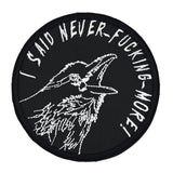 Circular white on black embroidered patch of a raven screaming, I said never-fucking-more!