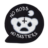 A black embroidered patch in the shape of a chat bubble with an evil-looking version of the reddit logo and the words, 'No Mods, No Masters'.