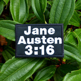 Rectangular black embroidered patch with white block lettering that says, 'Jane Austen 3:16".