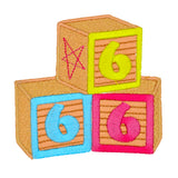 An embroidered patch resembling three children's building blocks showing the number six in three different colors.