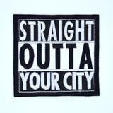 A square shaped white and black embroidered patch in the Straight Outta Compton format that can be customized with personal text.