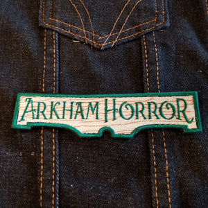 Embroidered patch for the Arkham Horror series of board games and card games.